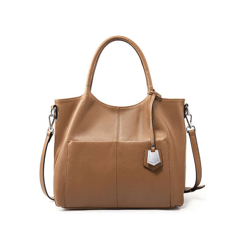 Woman holding an elegant brown leather handbag