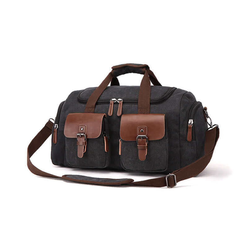 Black canvas gym duffle bag with leather buckle pockets and secure zip closure.