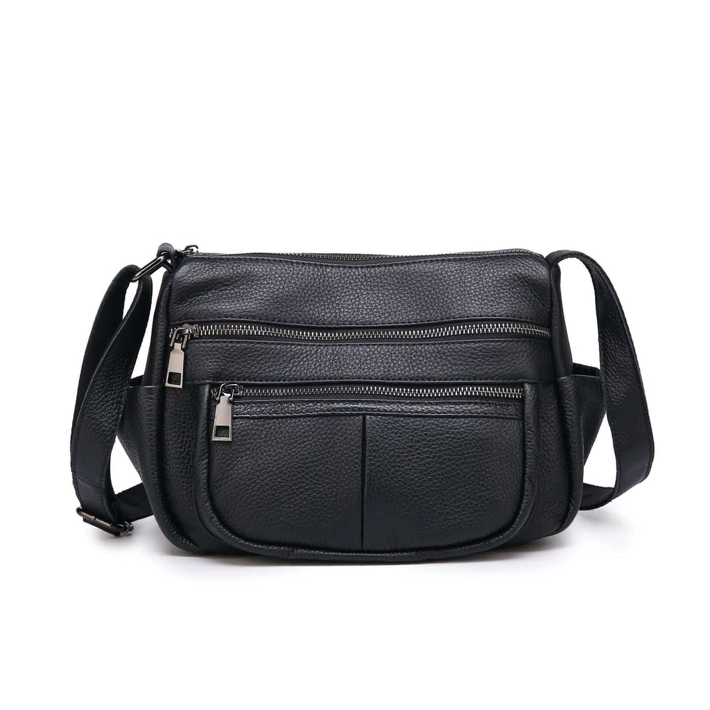 Front view of the black leather crossbody bag, featuring a sleek design and zippered pockets.