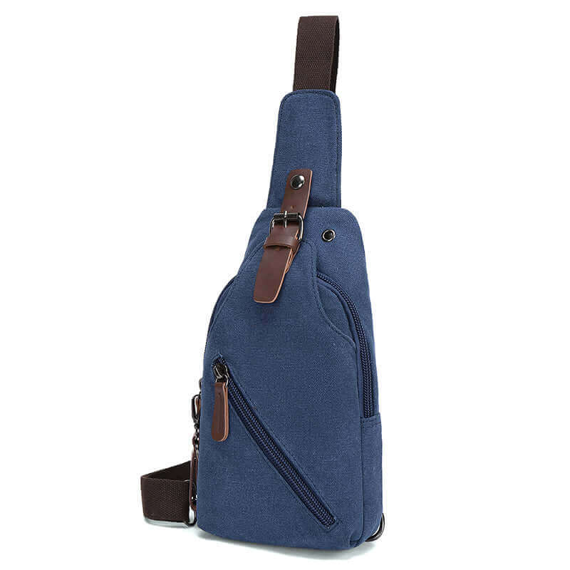 Side view of the blue canvas sling bag.