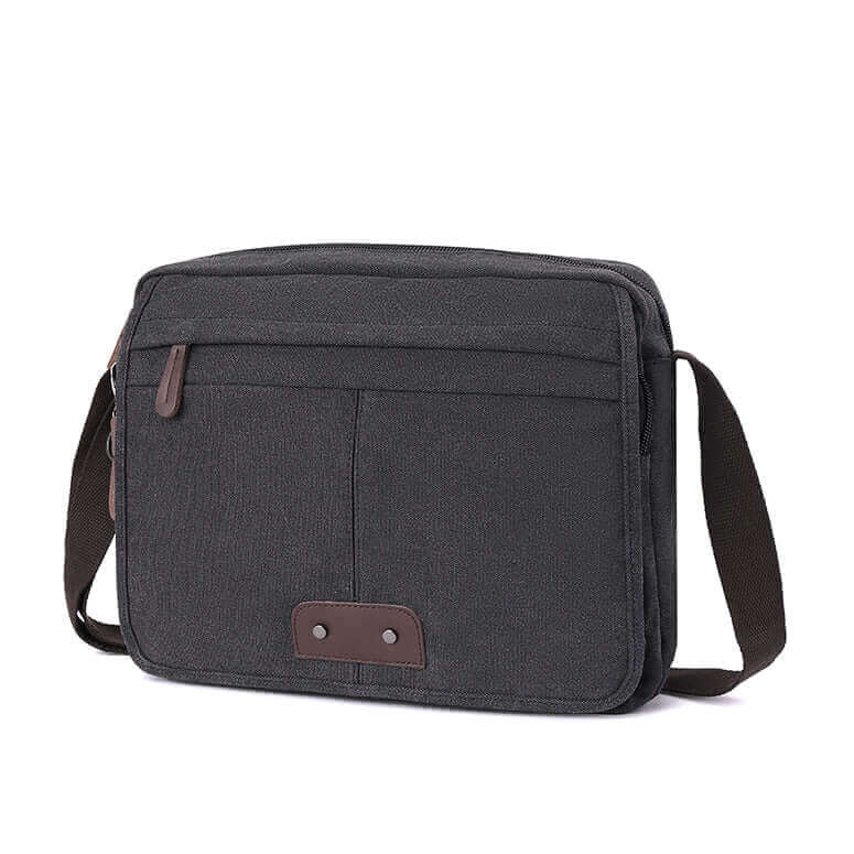 Men's canvas laptop messenger bag that fits 13.3 inch laptop, featuring durable materials and multiple compartments.