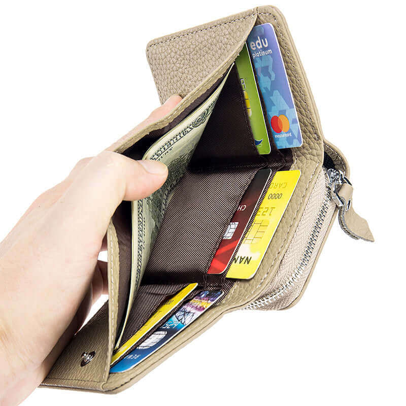 Open RFID leather wallet displaying card slots and cash storage.