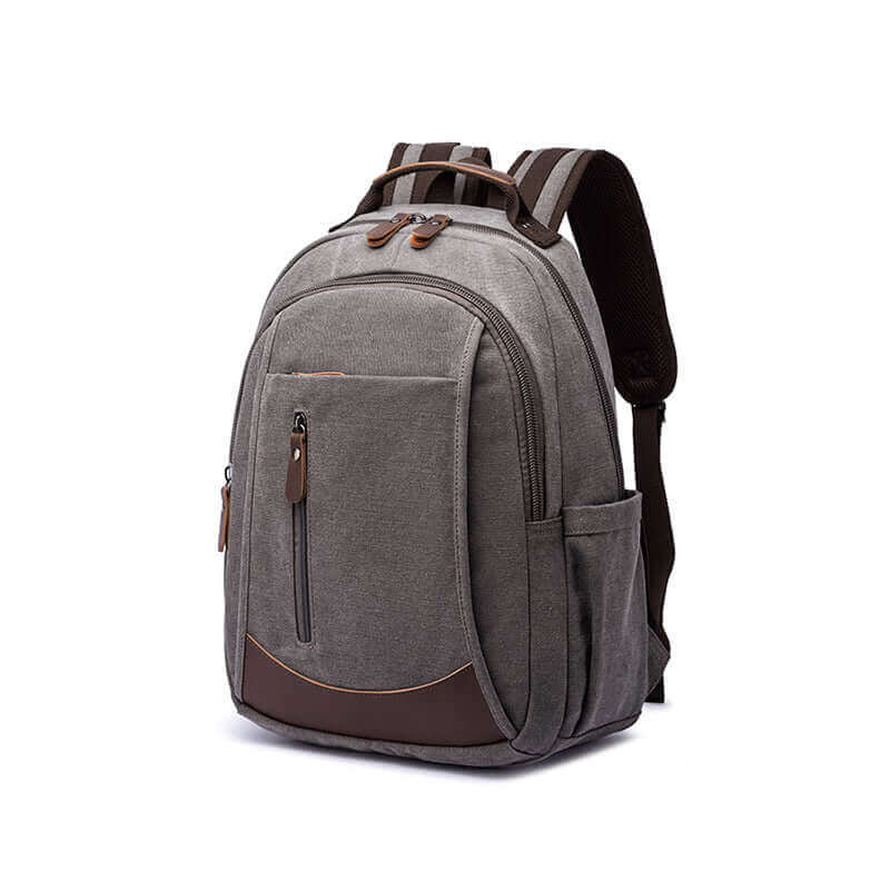 Canvas laptop backpack with PU leather accents, suitable for 15.6-inch laptops.