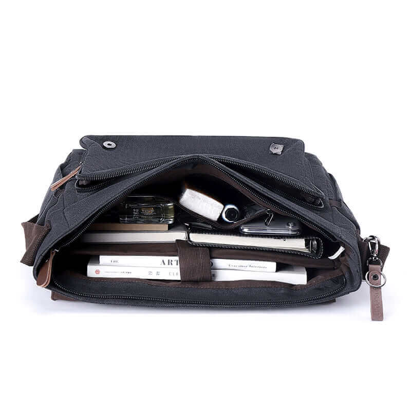 Internal structure of the black canvas crossbody laptop bag.