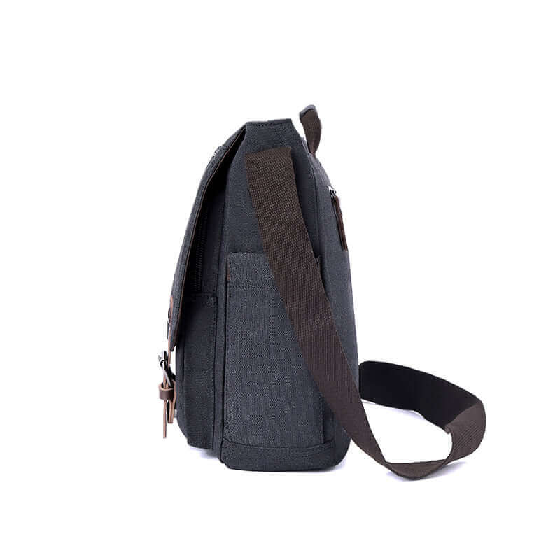 Side view of the black canvas messenger laptop bag.
