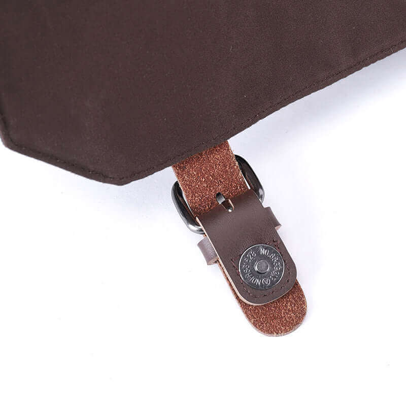 Partial details of the canvas shoulder crossbody bag.