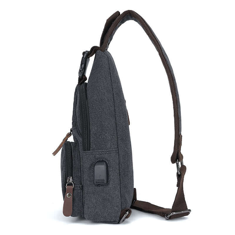 Side view of the canvas crossbody sling bag.