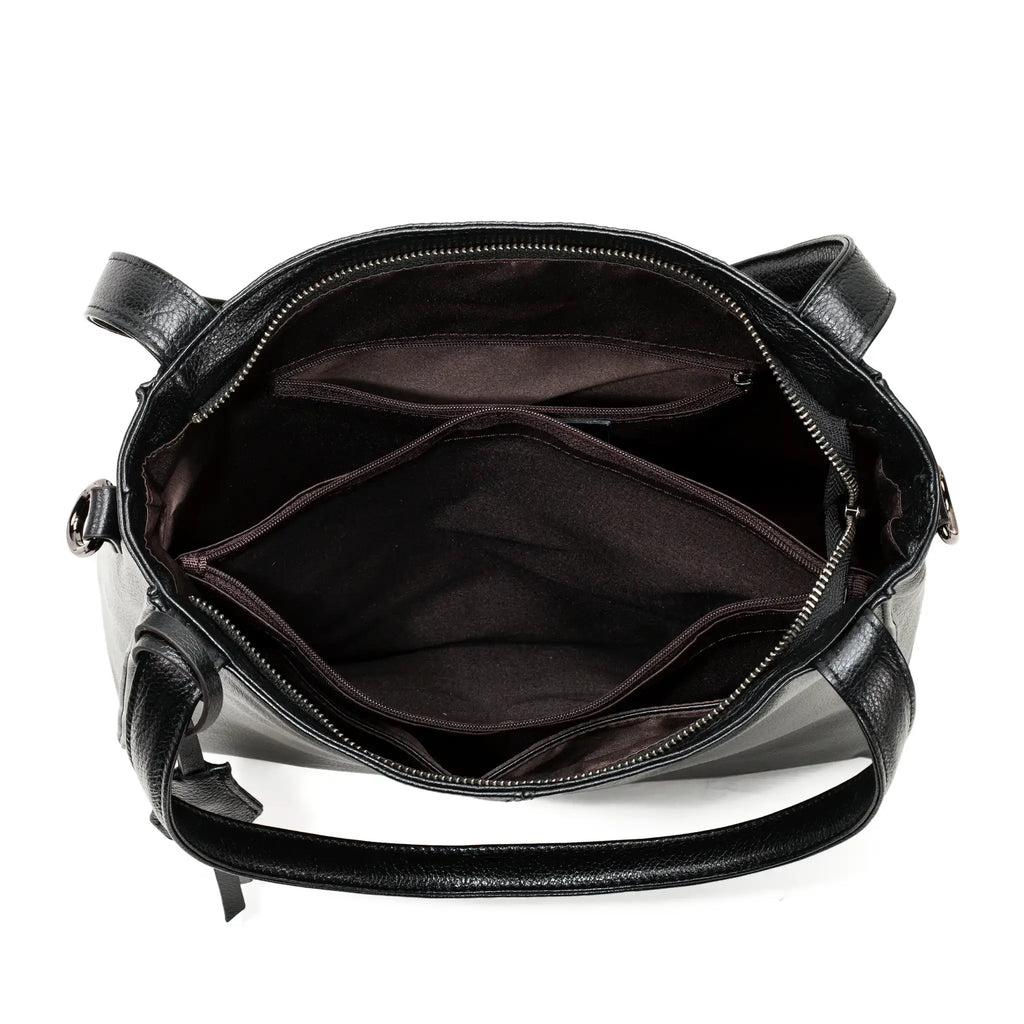 Interior space of black leather tote with lining