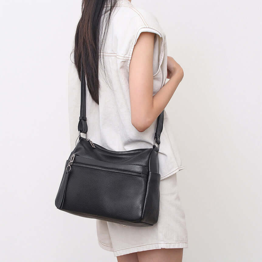 model wearing leather shoulder bag crossbody