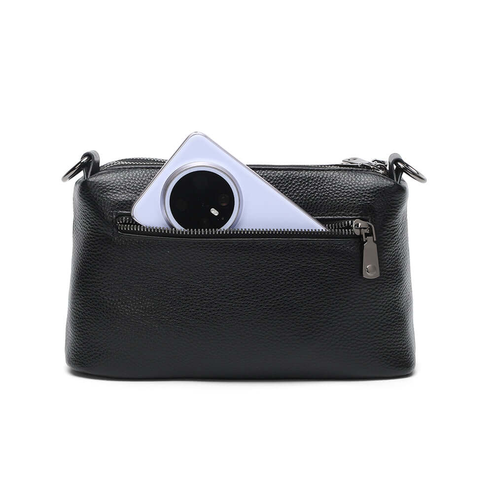 Black leather crossbody bag with a zippered back compartment.