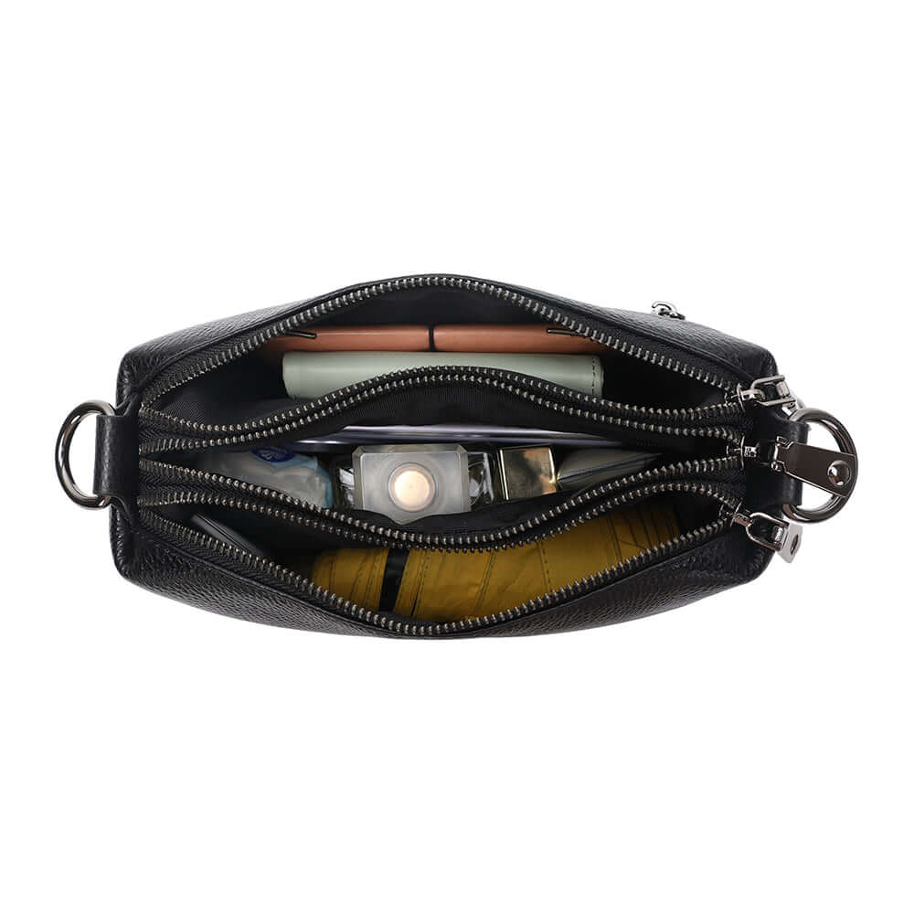 Interior of the black leather crossbody bag.
