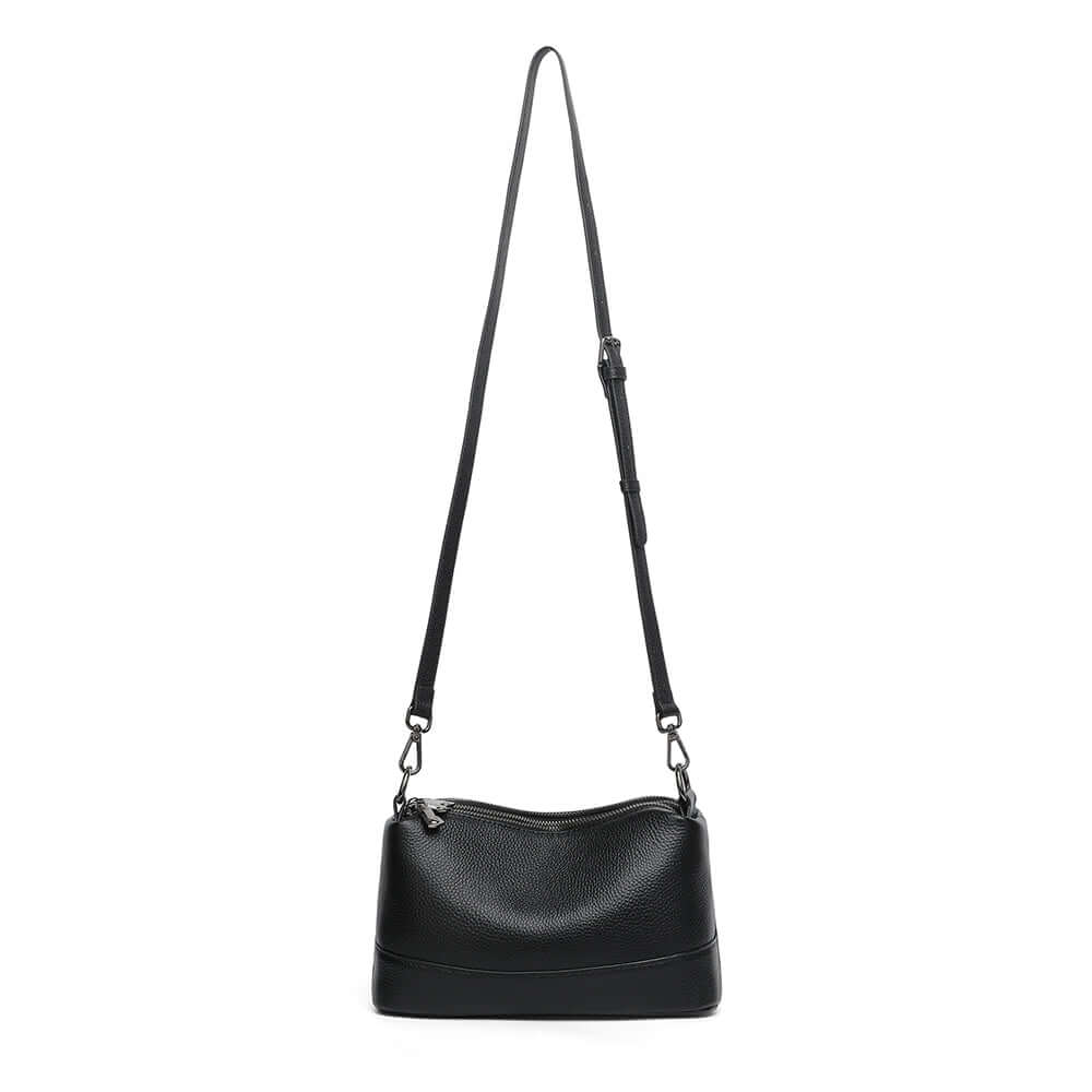 Black leather bag with long crossbody strap.