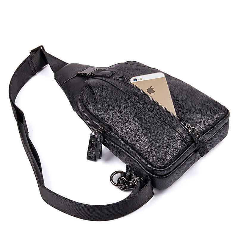 Detailed display of black genuine leather crossbody sling bag.