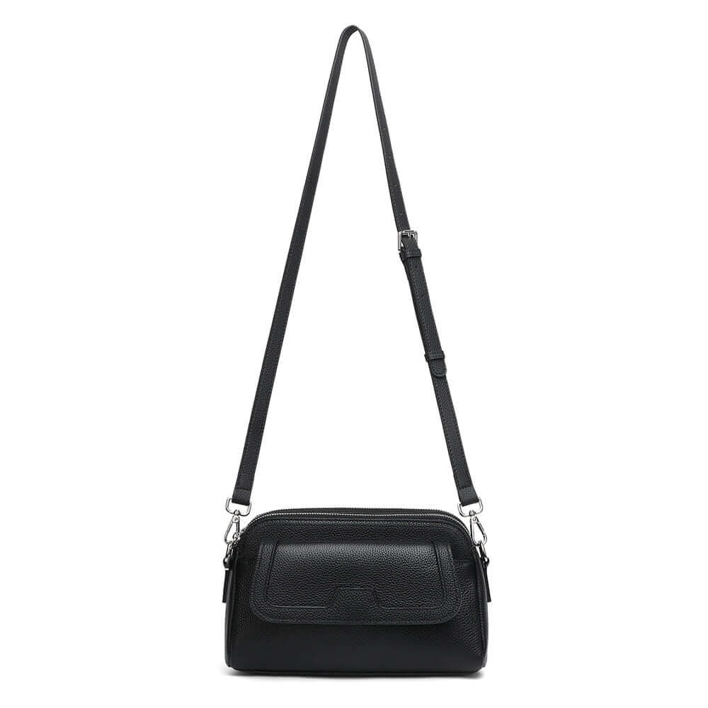 Women’s black leather crossbody bag with long shoulder strap.