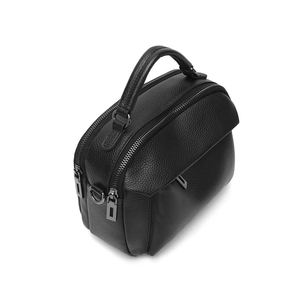 Angled view showing handbag shape and leather texture