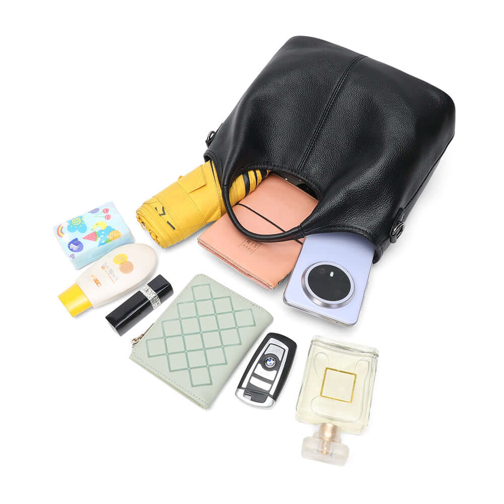 Everyday items stored inside leather handbag