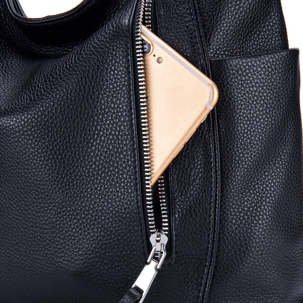 Details of the black genuine leather handbag.