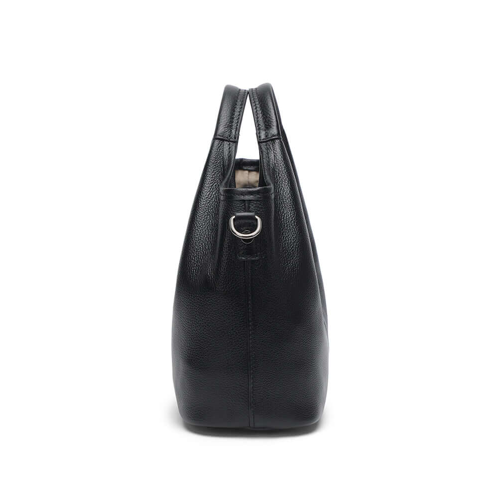 Side view of women’s black leather handbag