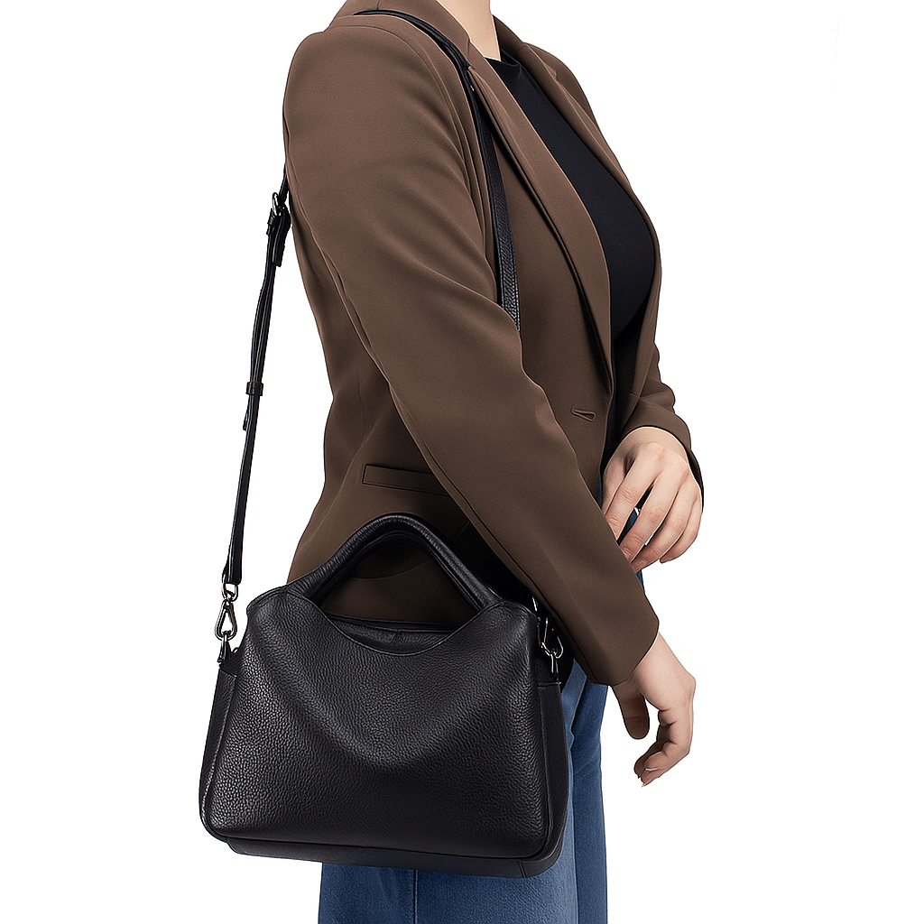 Model shows off black genuine leather handbag