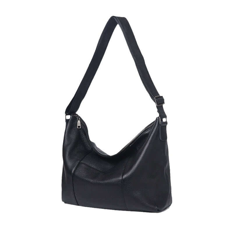 Side view of black leather shoulder bag for women.
