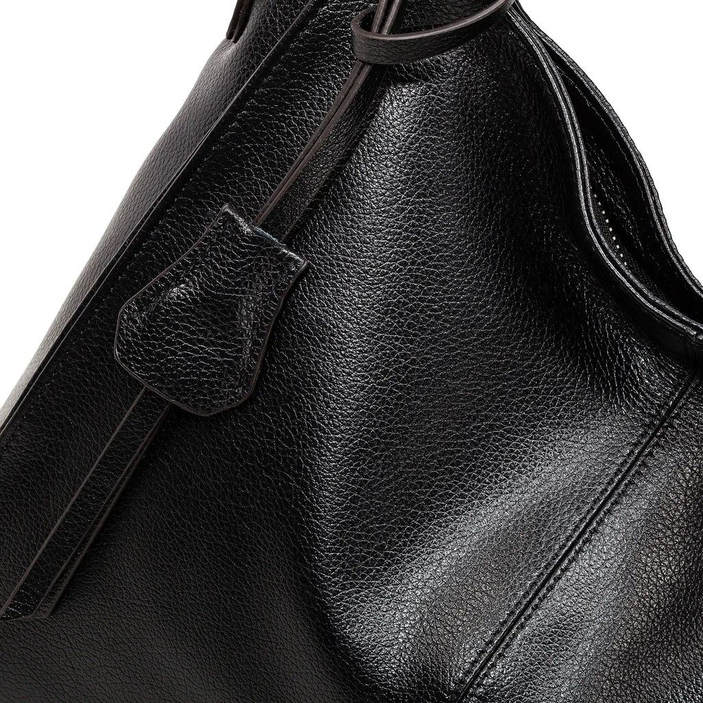 Spacious interior design of black leather tote for women