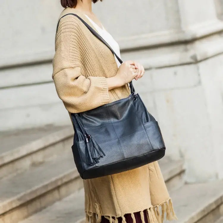 Black leather tote-style shoulder bag for women