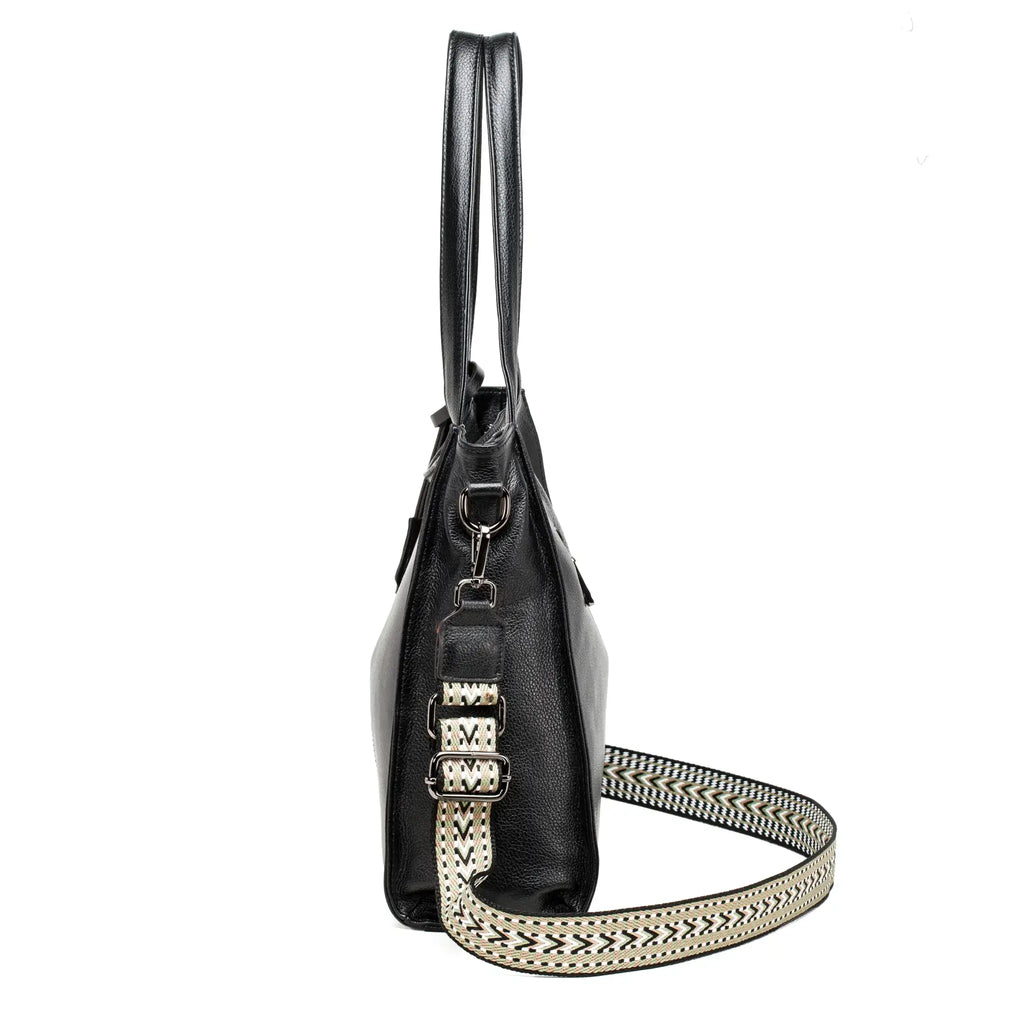 Side profile of black leather handbag showing soft texture