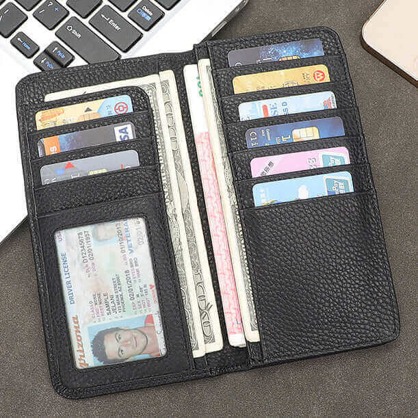 Interior of black bifold leather wallet with card slots and photo window.