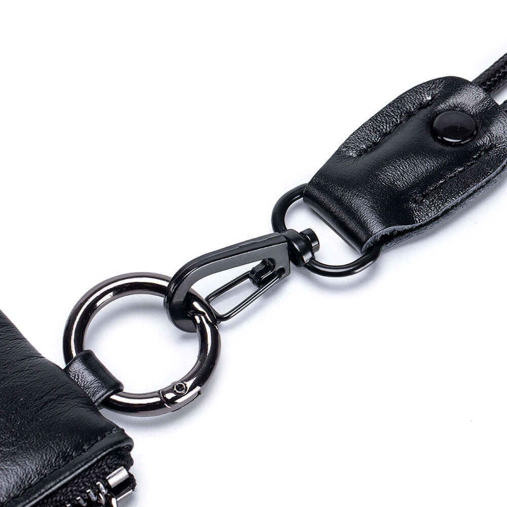 Black leather keychain with metal ring.