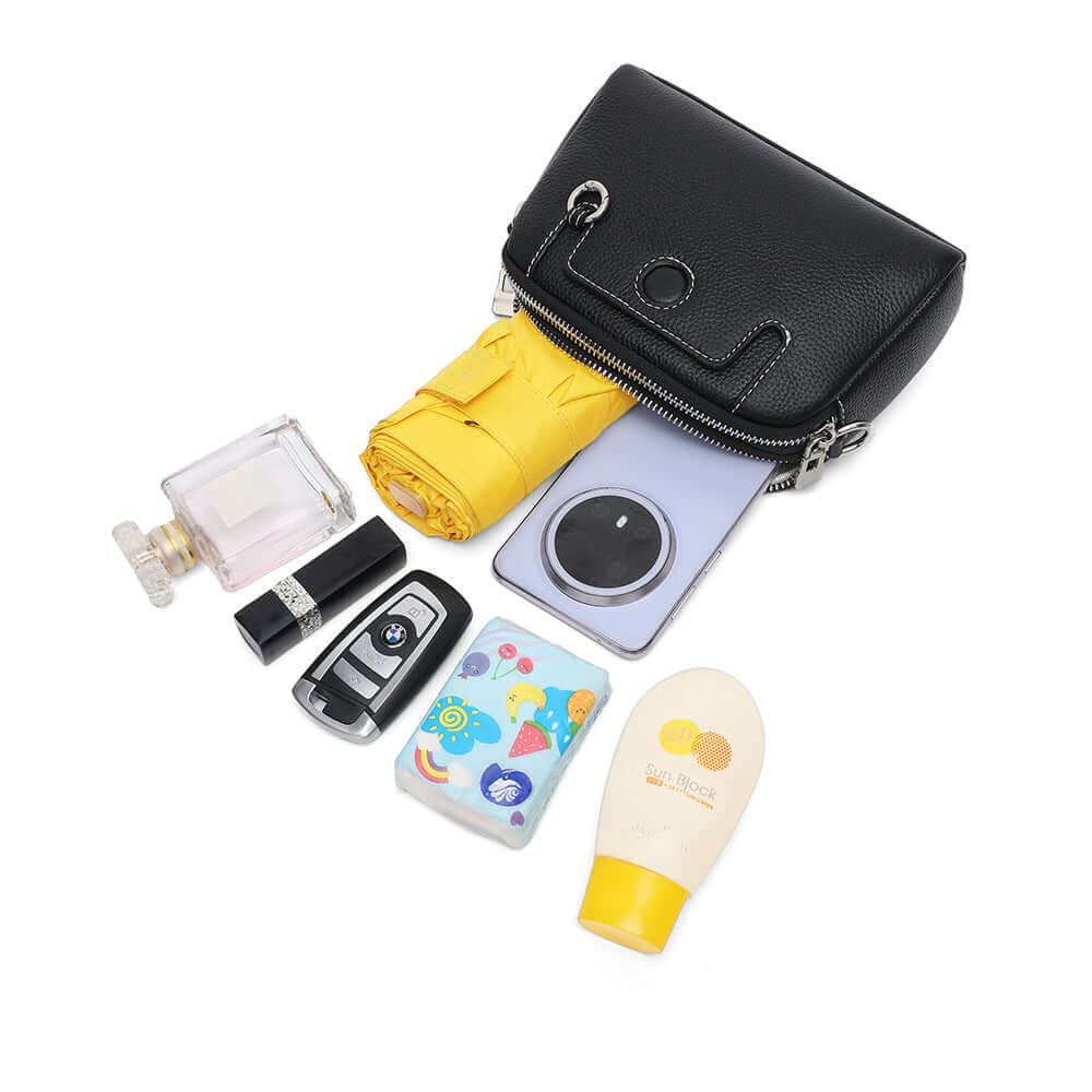 Angled top view showing two separate compartments of the mini leather bag.