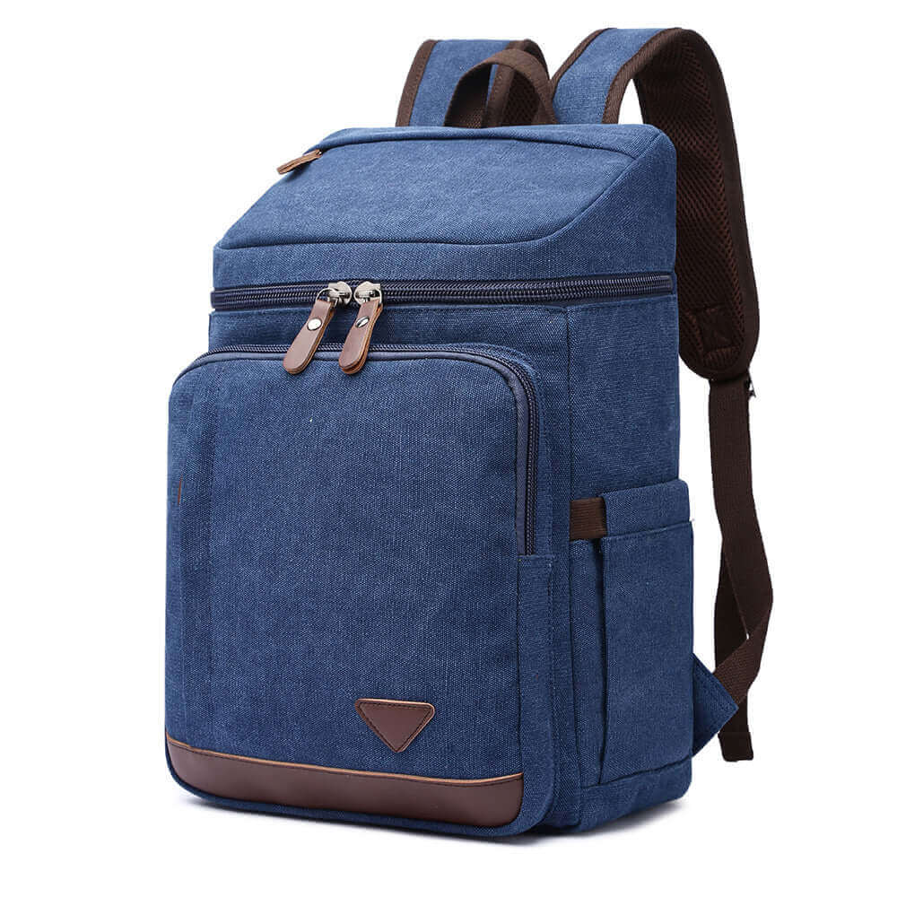 Blue canvas backpack for men and women, featuring PU leather accents for style.