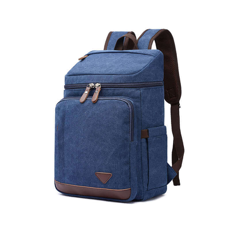 Blue canvas backpack for school, work, or casual use, featuring a 15.6-inch laptop compartment.