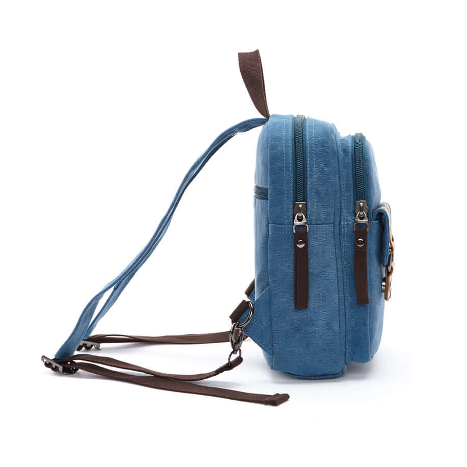 Side view of blue convertible canvas sling backpack