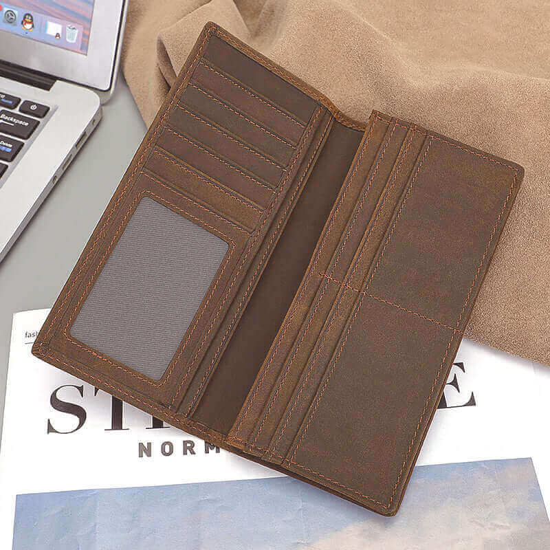 Open view of genuine leather long wallet with multiple card slots and compartments.