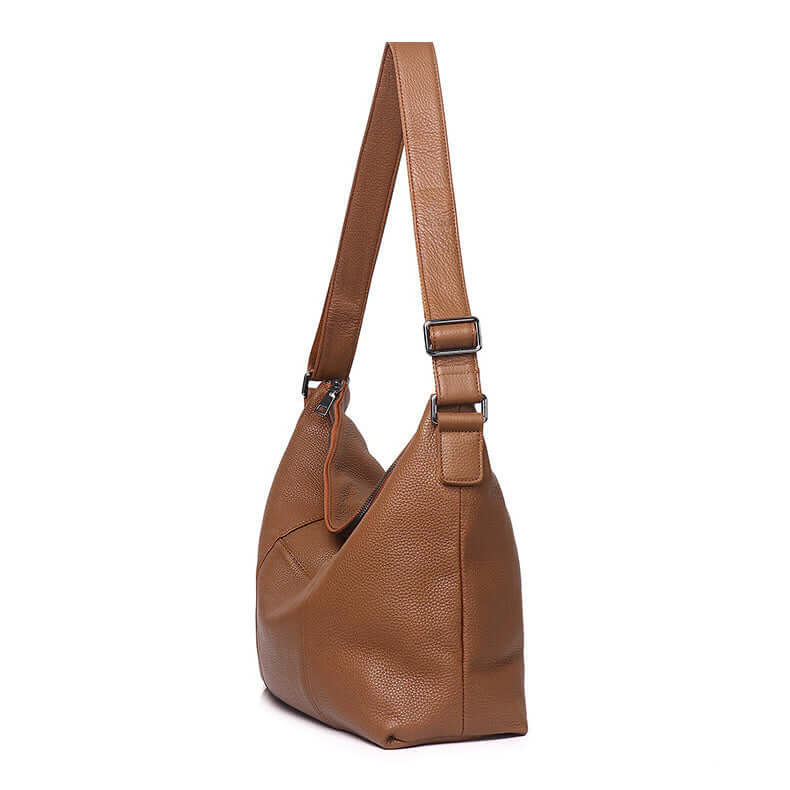 Side view of brown leather shoulder bag with soft genuine leather texture.