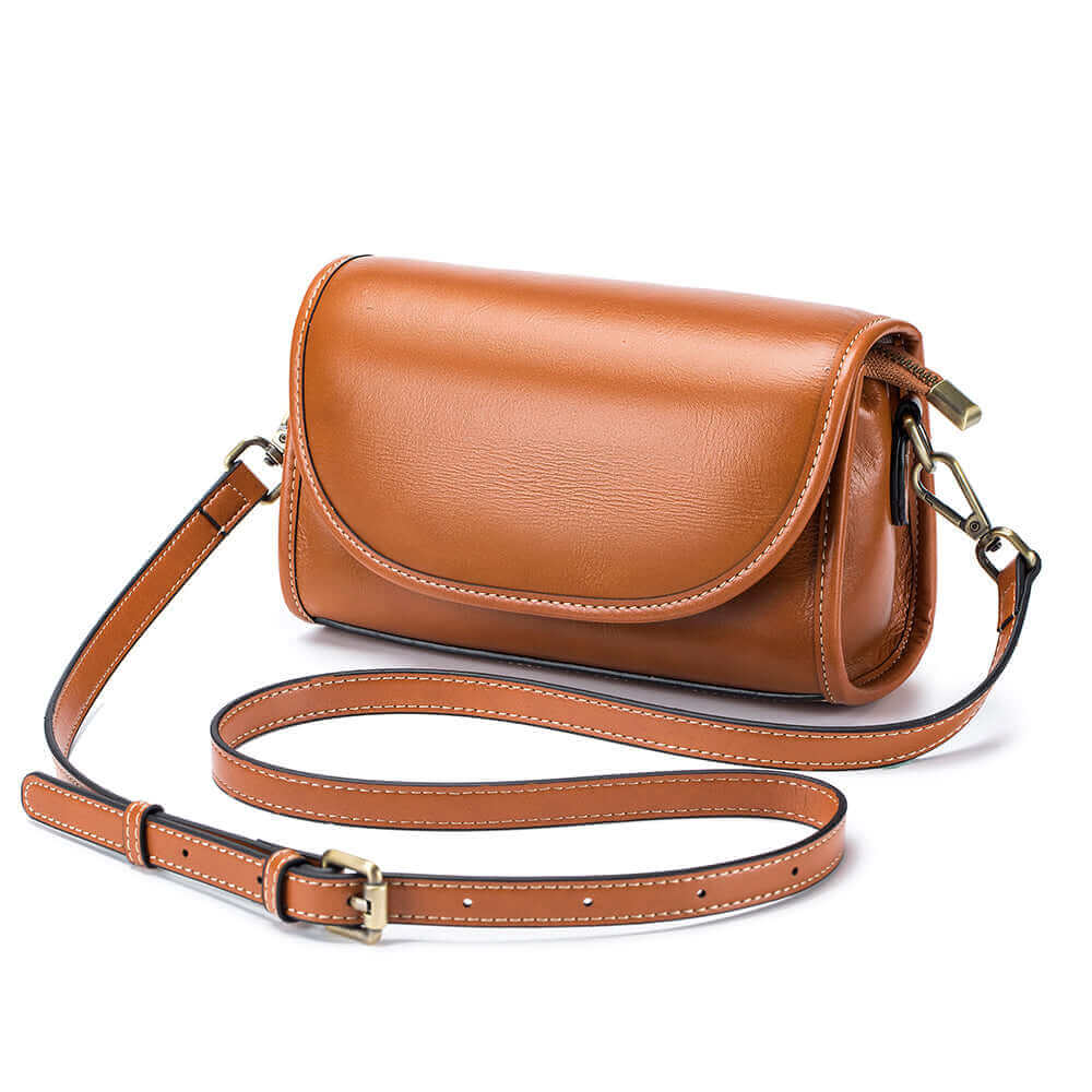 Brown leather crossbody shoulder bag with fabric strap