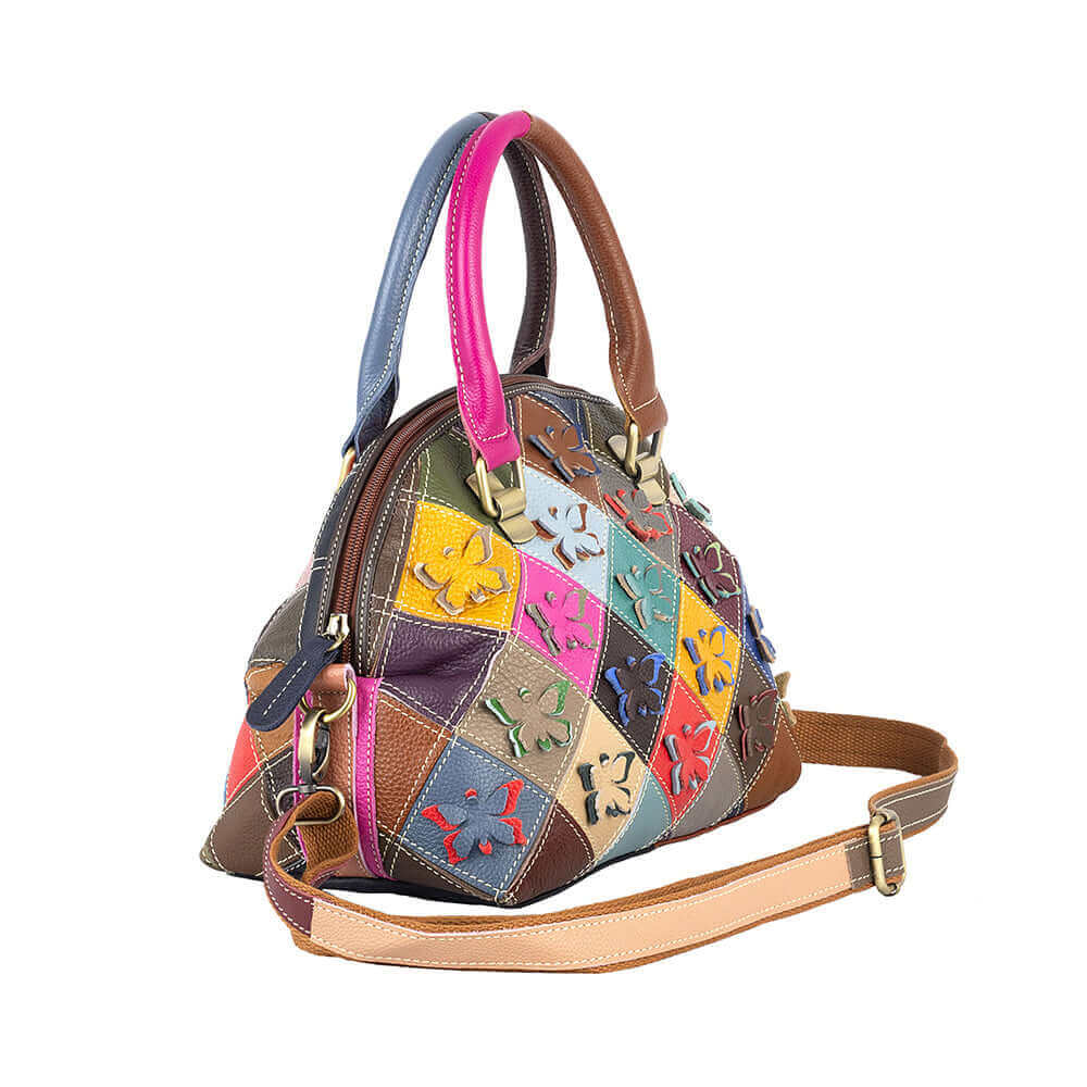 Butterfly leather handbag with adjustable shoulder strap.