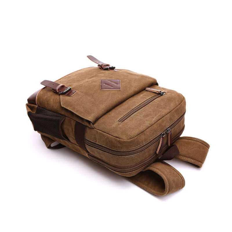 Canvas backpack featuring multiple compartments for organized storage.