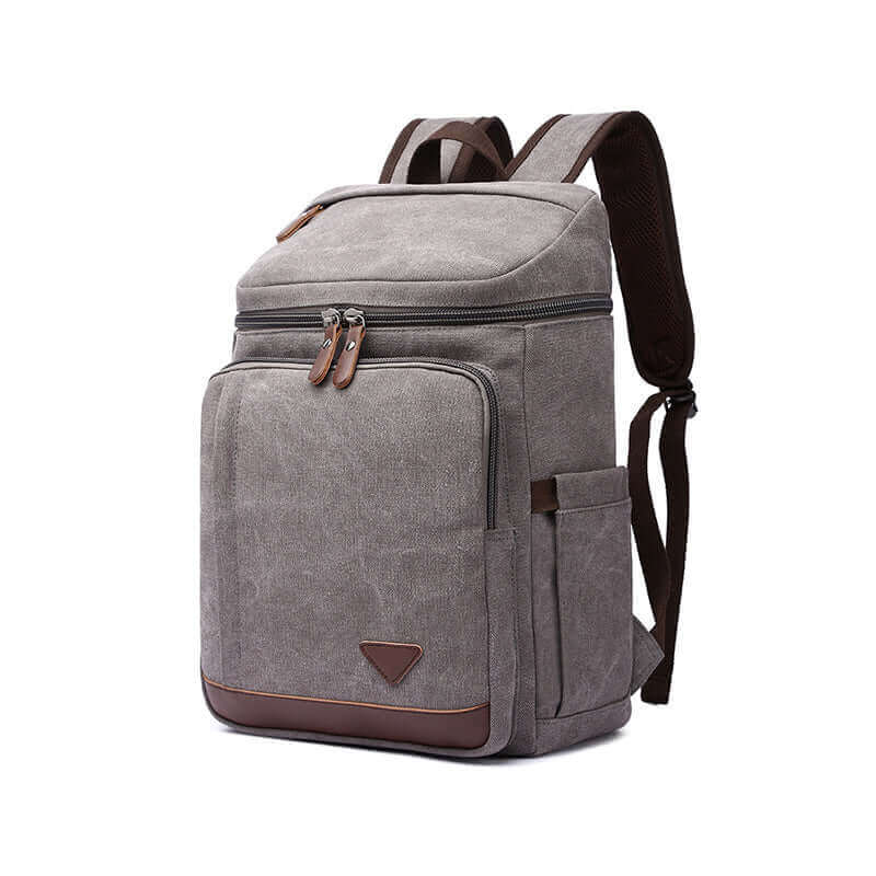 Canvas backpack with a laptop compartment for 15.6-inch devices, ideal for work and study.