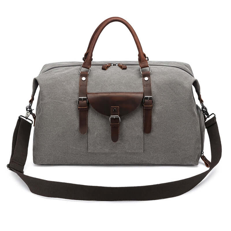 Adjustable shoulder strap on grey duffle bag
