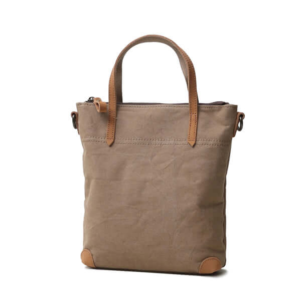 Khaki canvas handbag with minimalist design.