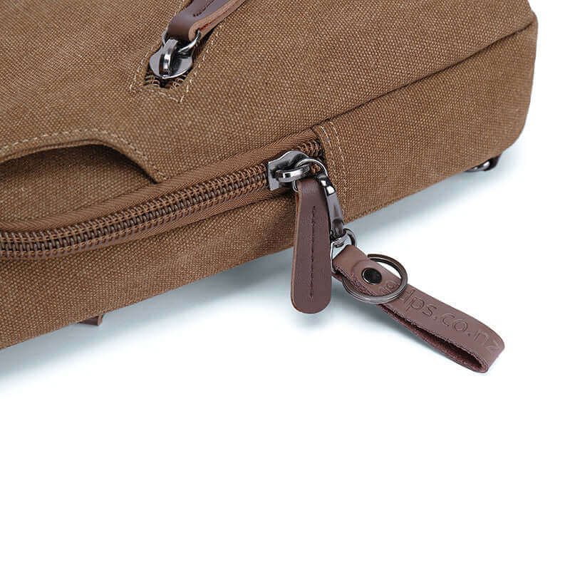 Details of the canvas sling crossbody bag.