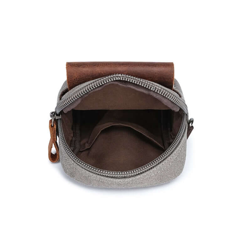 Grey canvas travel crossbody bag with leather pocket