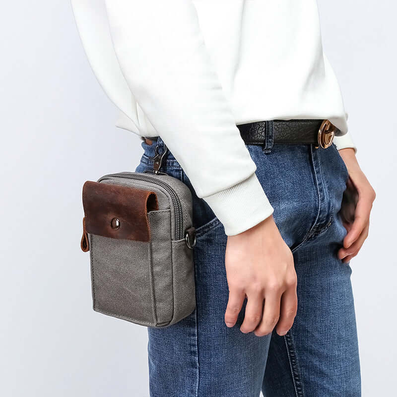 Grey canvas small bum bag worn on side