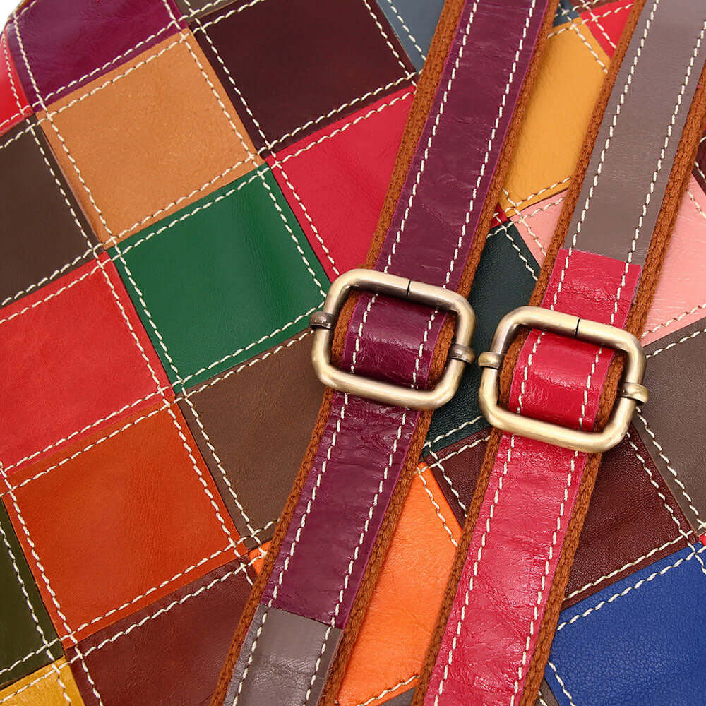 Close-up of vibrant patchwork design on the leather backpack.