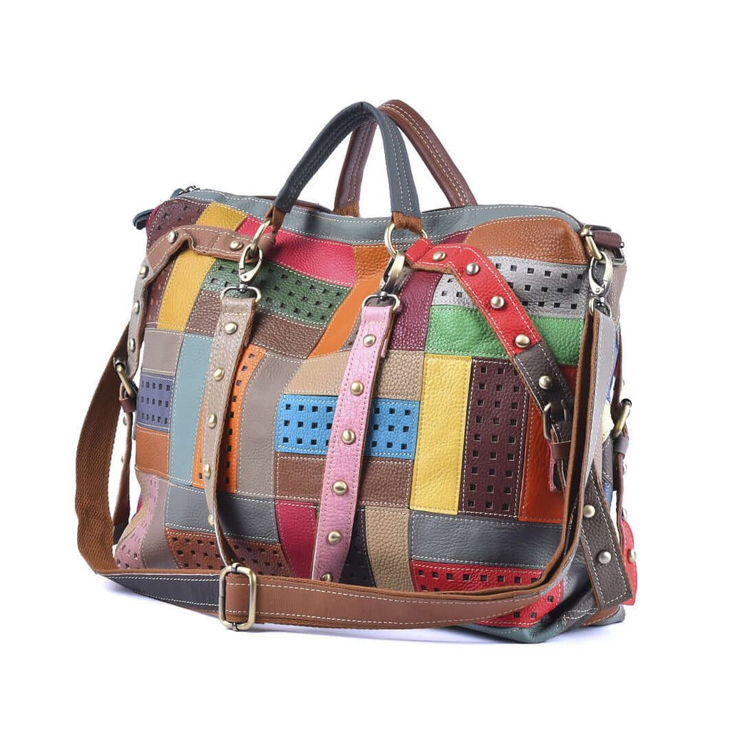 Adjustable strap detail of colorful leather patchwork handbag for versatile carrying.