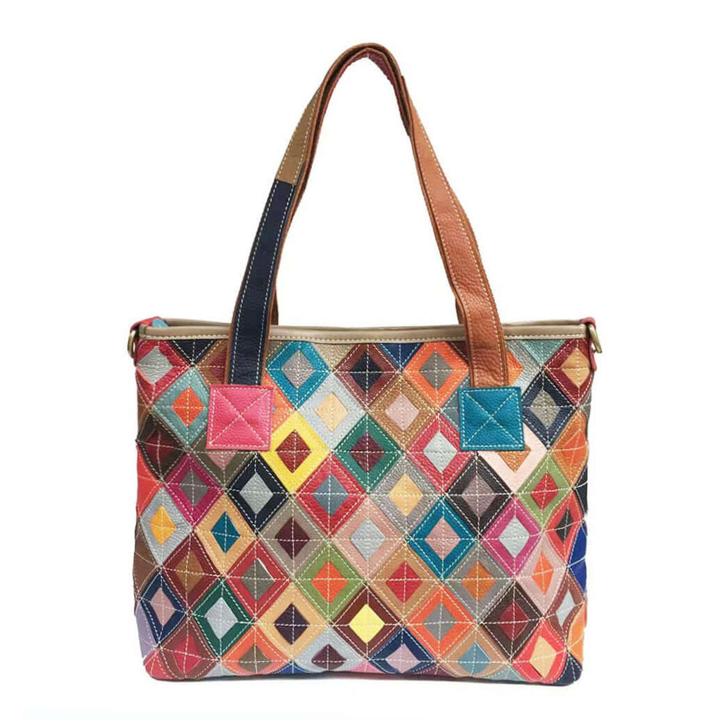 Front view of a colorful leather patchwork tote bag with vibrant geometric design