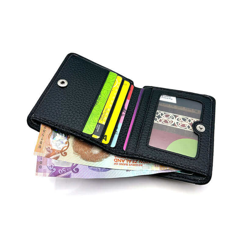 Compact leather wallet with RFID protection for women, offering space for cards, money, and photos.