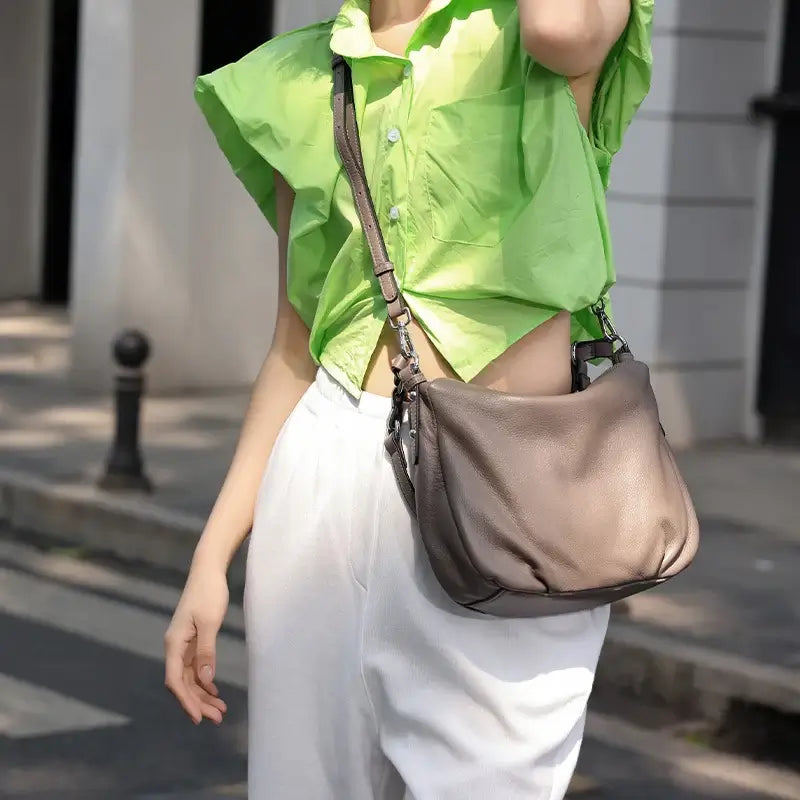 Crossbody styling of black leather handbag