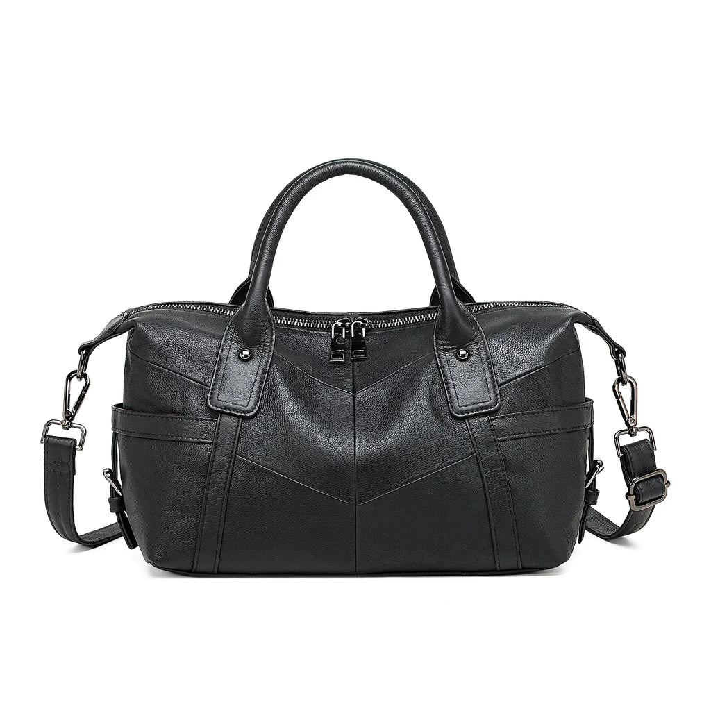 Black leather handbag with elegant shape and refined stitching